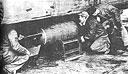 Fig. 27. Ground crew place a bomb aboard a B-24